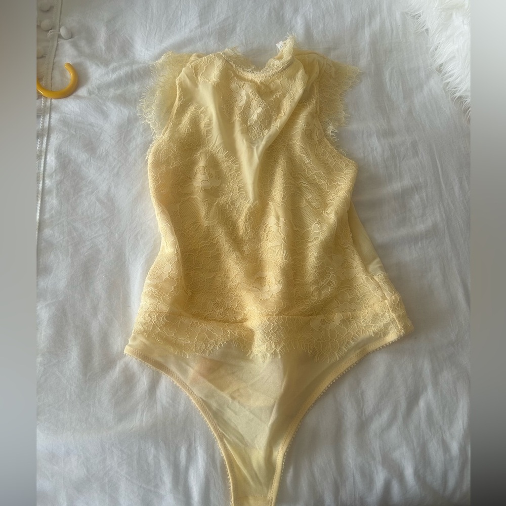 Free people Lace Bodysuit in yellow. Brand new with tags